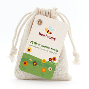 Leinenbeutel mit Etikett "bee happy", 25 Blumenmurmeln, "Gemeinsam lassen wir es blühen" Text und Blumenillustration.