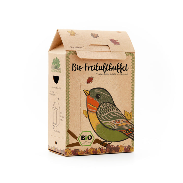 Kartonverpackung mit bunter Vogelzeichnung und der Aufschrift "Bio-Freiluftbuffet", Premium-Futter für Wild- und Singvögel.