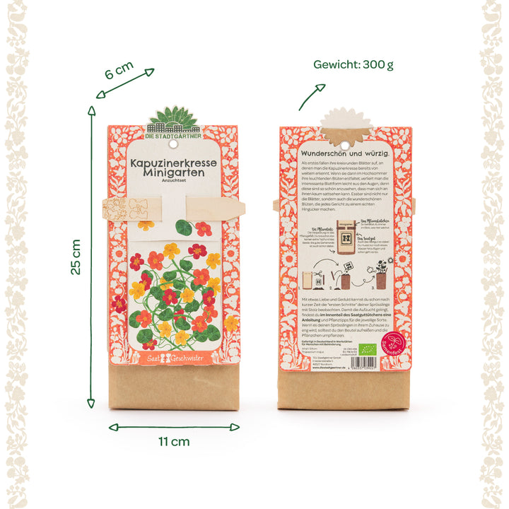 Zwei Packungen eines Kapuzinerkresse-Minigarten-Anzuchtsets mit floraler Verzierung, Abbildungen der Pflanze, Produktbeschreibung und den Maßen 25 cm hoch, 11 cm breit, 6 cm tief, Gewicht 300 g.