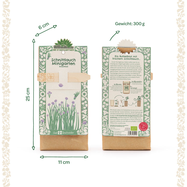 Zwei Packungen eines Schnittlauch Minigarten Anzuchtsets mit grün-weißem Blumenmuster, Maße 25 x 11 x 6 cm, Gewicht 300 g, Vorder- und Rückseite sichtbar, Produktinformationen auf Deutsch.
