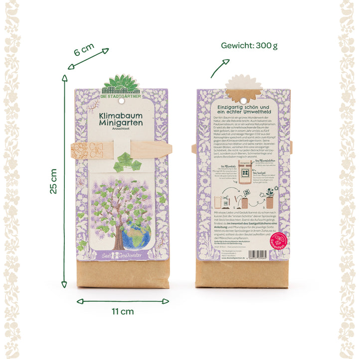 Zwei Packungen eines Klimabaum Minigarten Anzuchtsets mit lila Muster, Größenangaben (25 cm x 11 cm x 6 cm) und einem Gewicht von 300 g, Vorder- und Rückseite sichtbar.