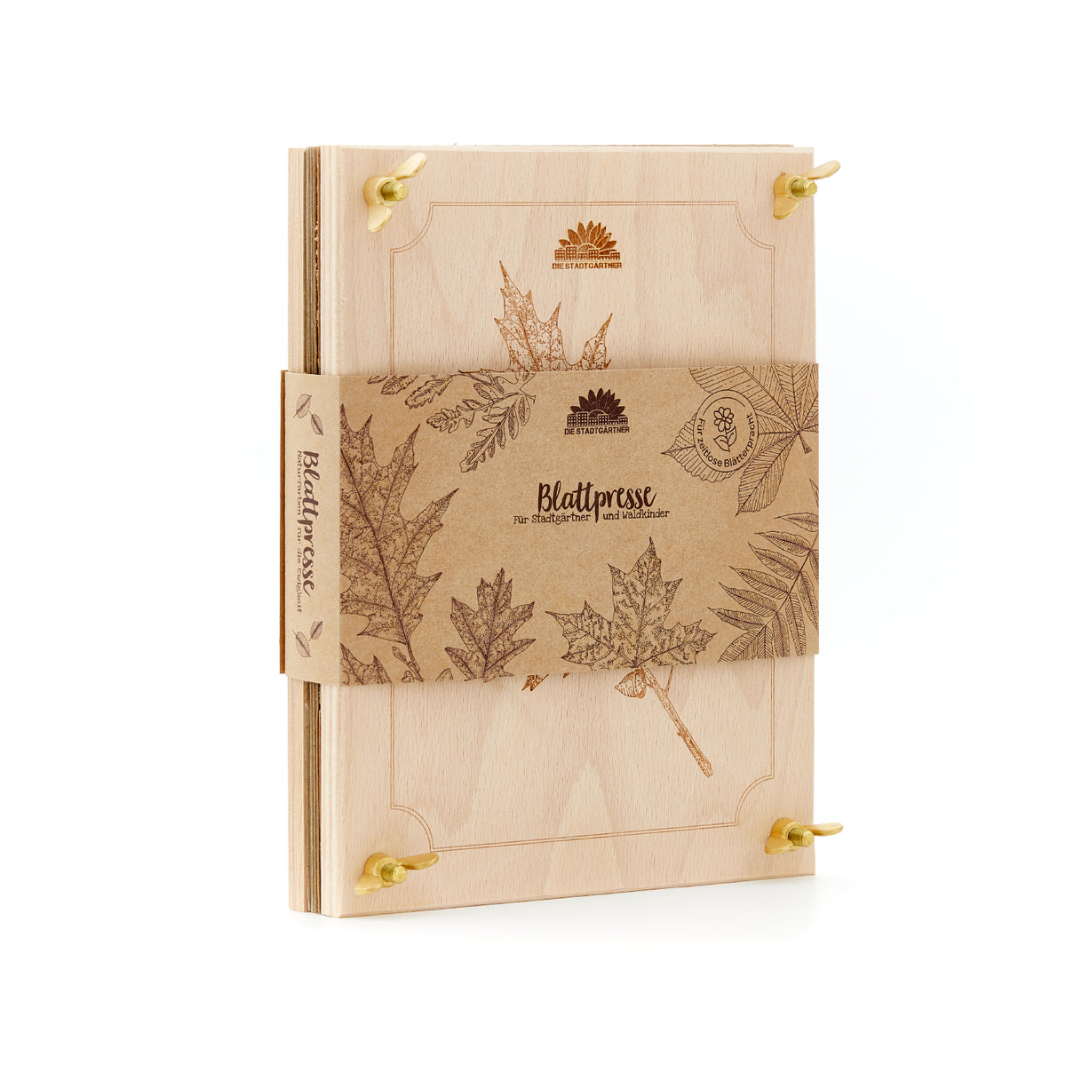 Holzpresse für Blätter mit botanischen Gravuren und braunem Papierband, darauf Blattmotive und der Schriftzug „Blattpresse“.