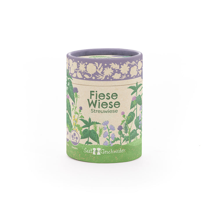 Runde Dose mit der Aufschrift "Fiese Wiese Streuwiese" und floralen Illustrationen, Produkt von SaatGeschwister.