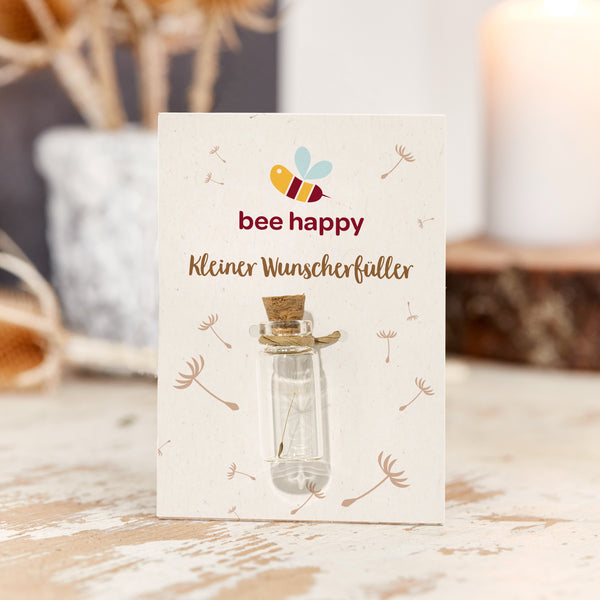 Paardenbloem-pluisjes in een glas