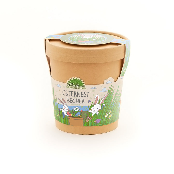 Bastelbecher aus Karton mit Osterhasen-Illustration und der Aufschrift „Osternest Becher“ von Die Stadtgärtner.