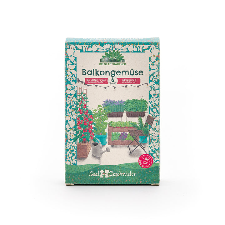 Verpackung einer Saatgutbox mit der Aufschrift "Balkongemüse" und einer Abbildung von verschiedenen Gemüsepflanzen auf einem Balkon.
