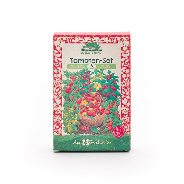 Verpackung eines Tomaten-Sets mit buntem Tomatenmotiv und der Aufschrift "Tomaten-Set – 6 Sorten – Bio-Saatgut für Tomatenliebhaber" auf Deutsch.