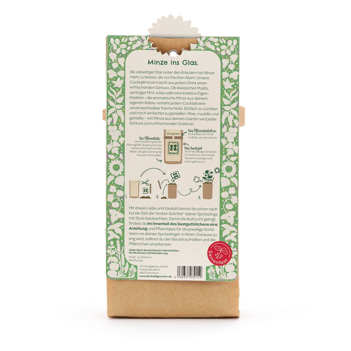 Rückseite einer Verpackung mit Anleitung zur Anzucht von Minze im Glas, umgeben von grün-weißem Blumenmuster.