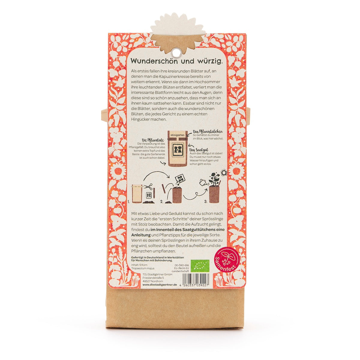 Rückseite einer Saatgut-Verpackung mit deutscher Beschreibung, Illustrationen zur Aussaat und orange-weißem Blumenmuster.