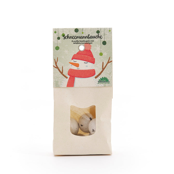 Papiertüte mit Sichtfenster, enthält weiße Saatkugeln, Verpackung mit Schneemann-Illustration und der Aufschrift "Schneemannbäuche – 8 weiße Saatkugeln mit Wildblumensaatgut".