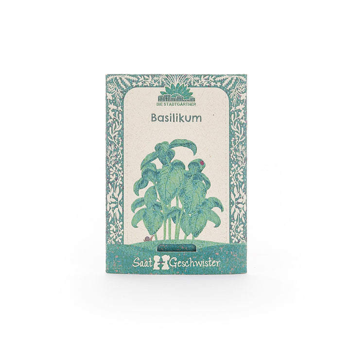 Saatguttüte für Basilikum der Marke "Saatgeschwister" mit einer Illustration von Basilikumblättern auf der Vorderseite.