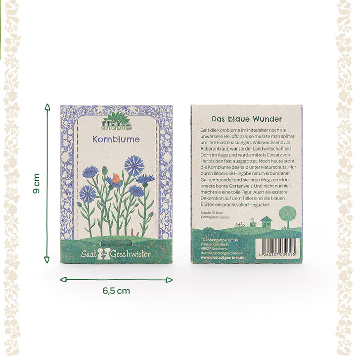 Zwei Saatgutverpackungen für Kornblumen mit floraler Illustration und Produktbeschreibung auf Deutsch, daneben Maßangaben 9 cm hoch und 6,5 cm breit.