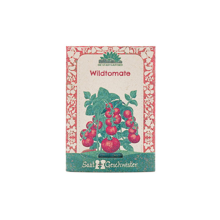 Saatgut-Packung mit der Aufschrift "Wildtomate" und einer Illustration von Tomatenpflanzen.