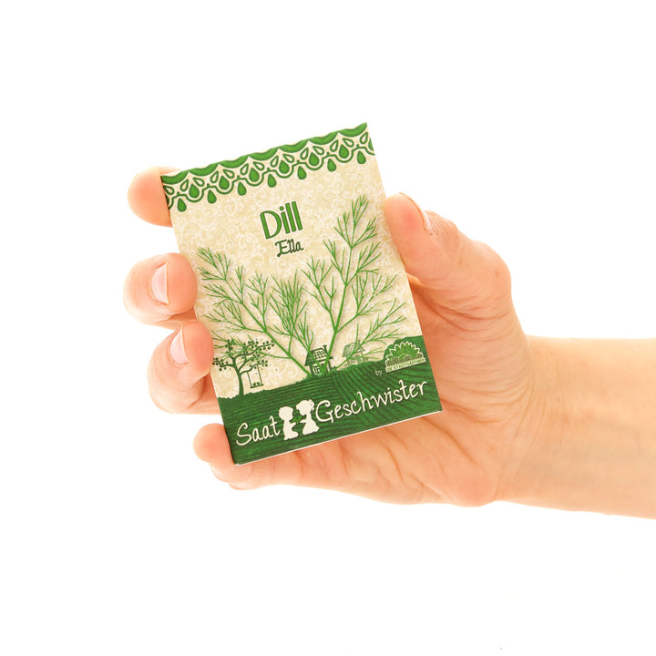 Hand hält eine Dill-Samentüte mit der Aufschrift "Saati & Geschwister".